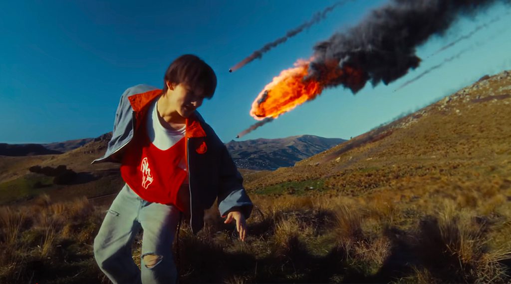 The "JoyRide" music video by CORTIS is noted for its creative reverse-motion storytelling and scenic filming in New Zealand